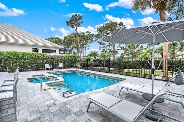 a view of a swimming pool with a patio