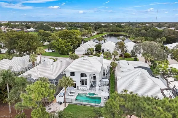 an aerial view of a house with a ocean view