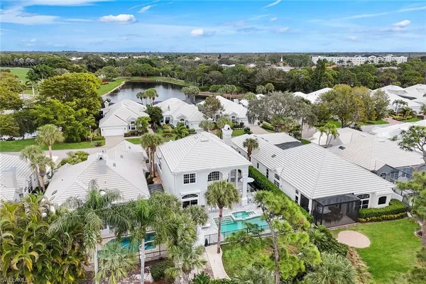 an aerial view of a house with a lake view