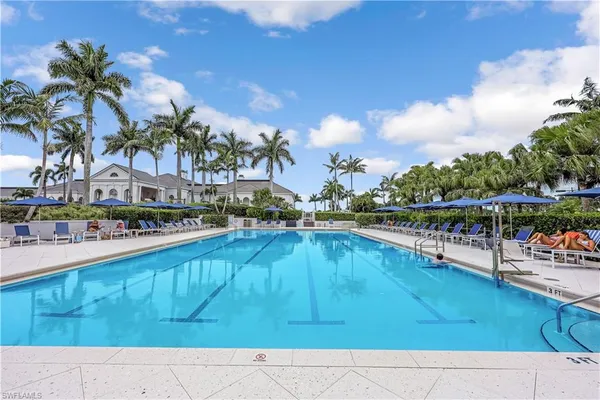 a view of swimming pool with outdoor seating
