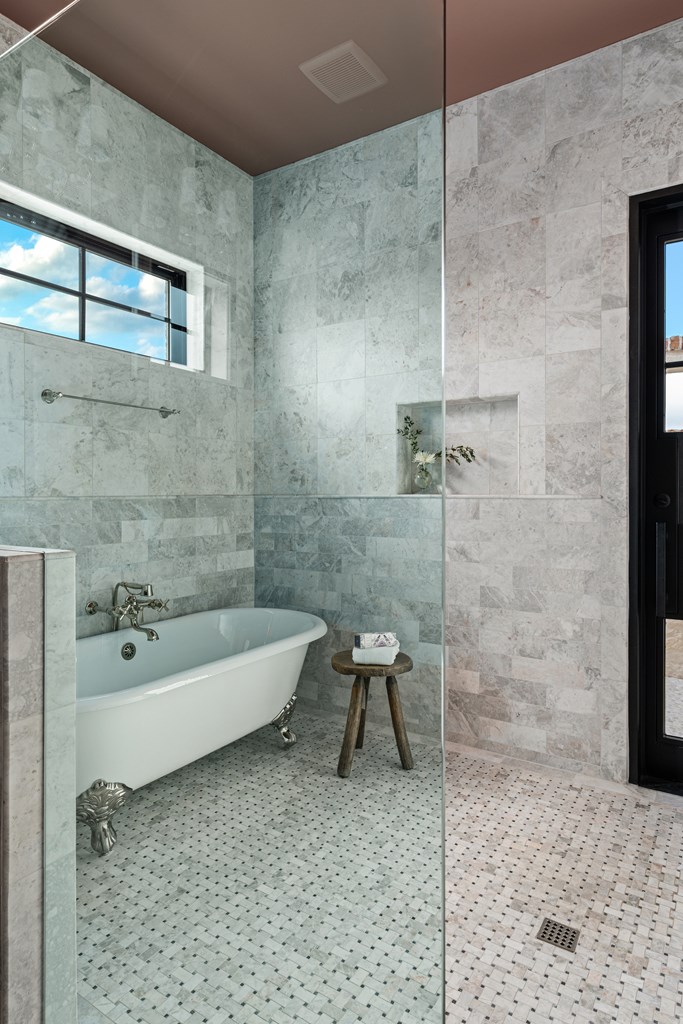 4412 Comanche Trace Drive Kerrville, TX 78028 - Photo 30 of 46 a bathroom with a tub a toilet and a shower