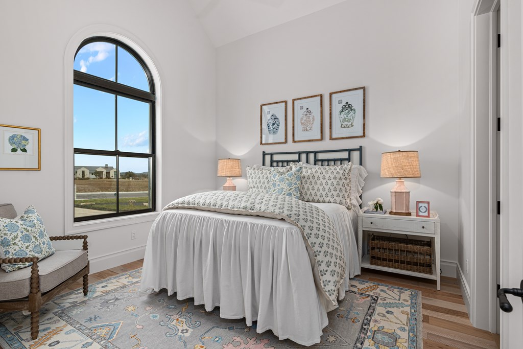 4412 Comanche Trace Drive Kerrville, TX 78028 - Photo 35 of 46 a bedroom with a bed and a window