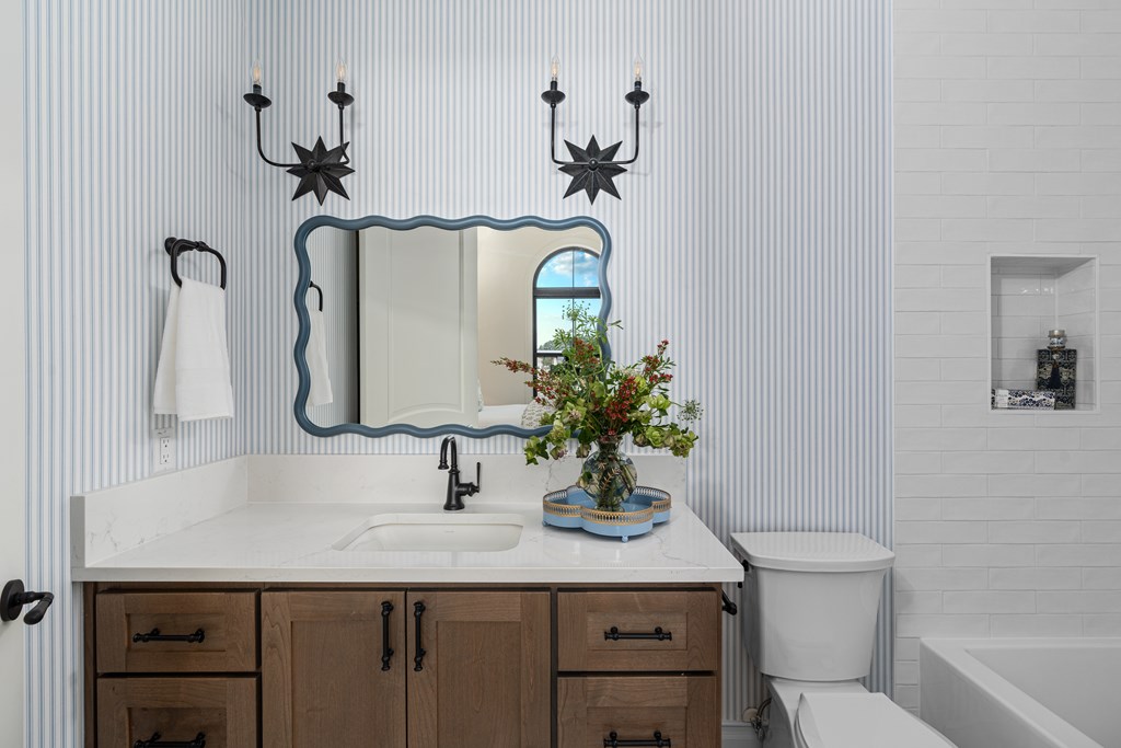 4412 Comanche Trace Drive Kerrville, TX 78028 - Photo 36 of 46 a bathroom with a toilet sink and mirror