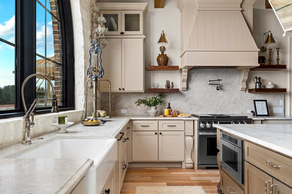 4412 Comanche Trace Drive Kerrville, TX 78028 - Photo 10 of 46 a kitchen with a sink stove and cabinets