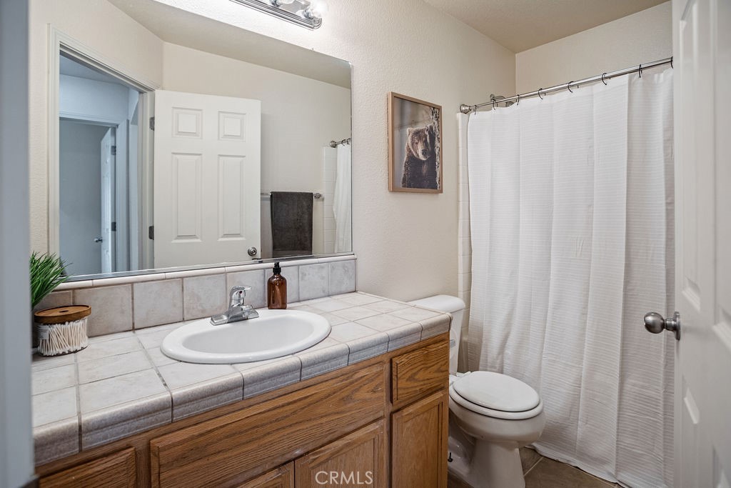 2344 Siena Court Merced, CA 95341 - Photo 11 of 19 a bathroom with a sink toilet and shower