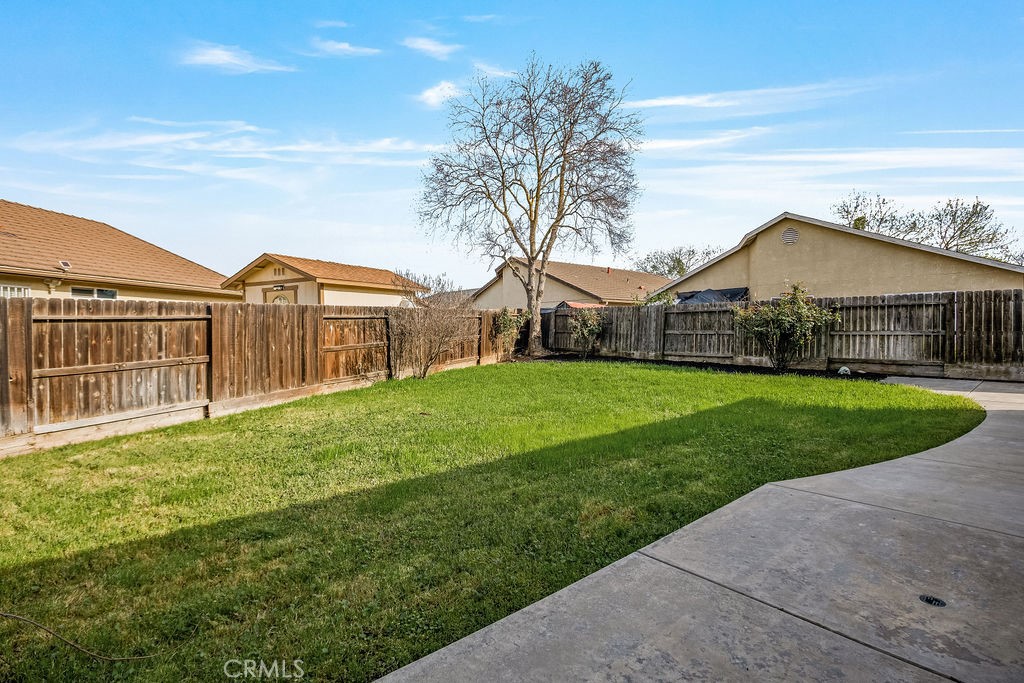 2344 Siena Court Merced, CA 95341 - Photo 15 of 19 a view of a house with a yard and potted plants