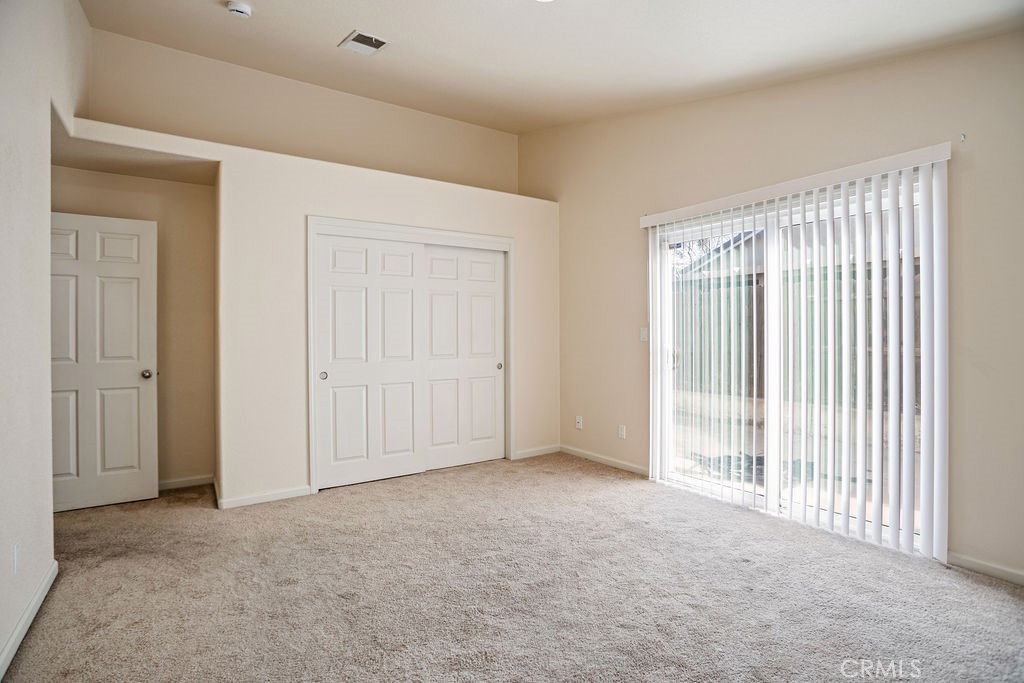 2344 Siena Court Merced, CA 95341 - Photo 10 of 19 a view of a livingroom with an empty space and a window