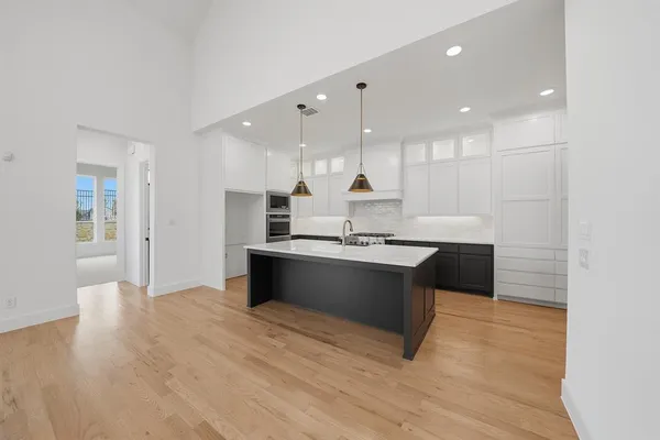 a kitchen with a sink and cabinets