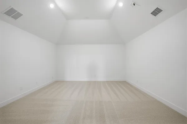 a view of an empty room and a window