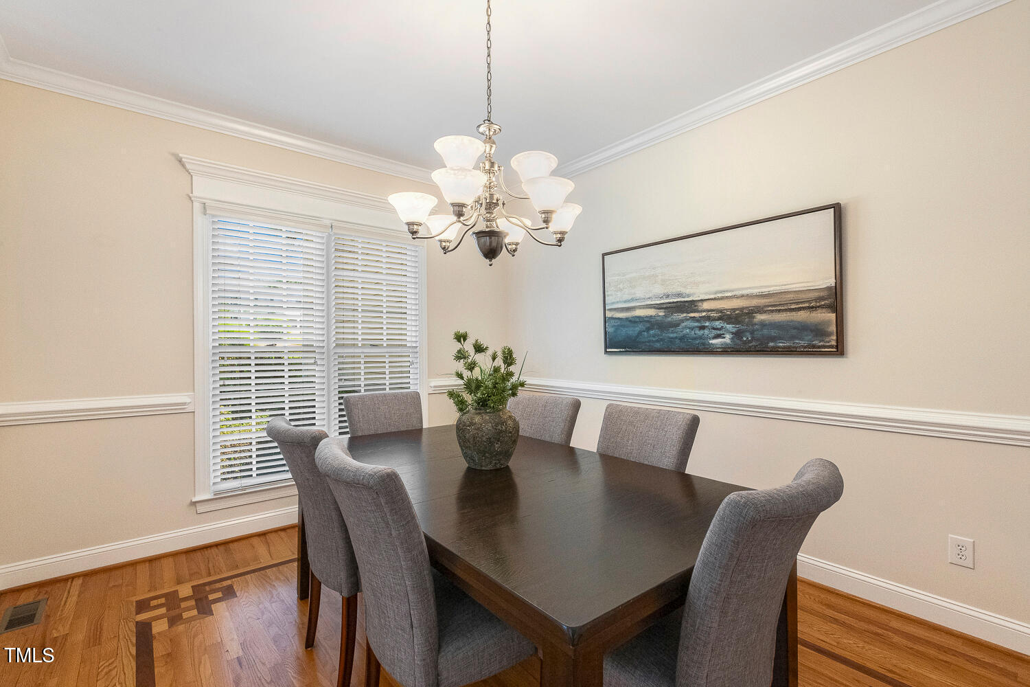 2628 Hunters Meadow Lane Raleigh, NC 27606 - Photo 11 of 76 a view of a dining room with furniture wooden floor and a chandelier