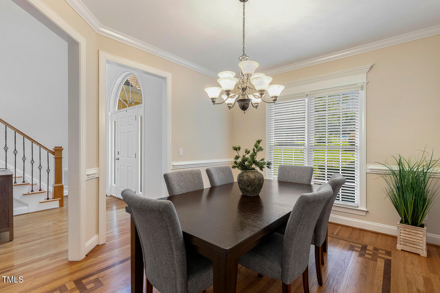 2628 Hunters Meadow Lane Raleigh, NC 27606 - Photo 13 of 76 a view of a dining room with furniture window and wooden floor