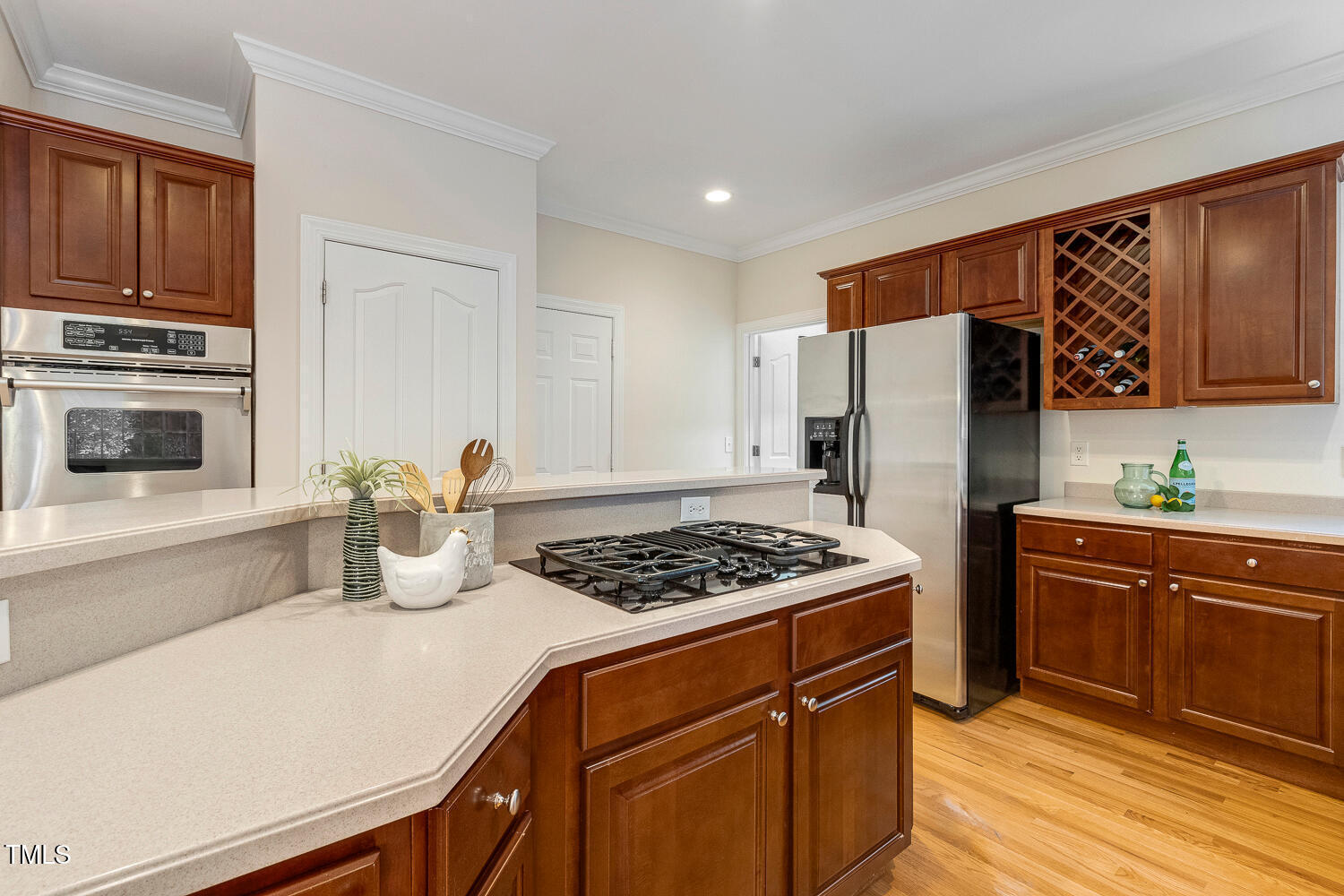 2628 Hunters Meadow Lane Raleigh, NC 27606 - Photo 18 of 76 a kitchen with stainless steel appliances granite countertop a refrigerator stove and sink
