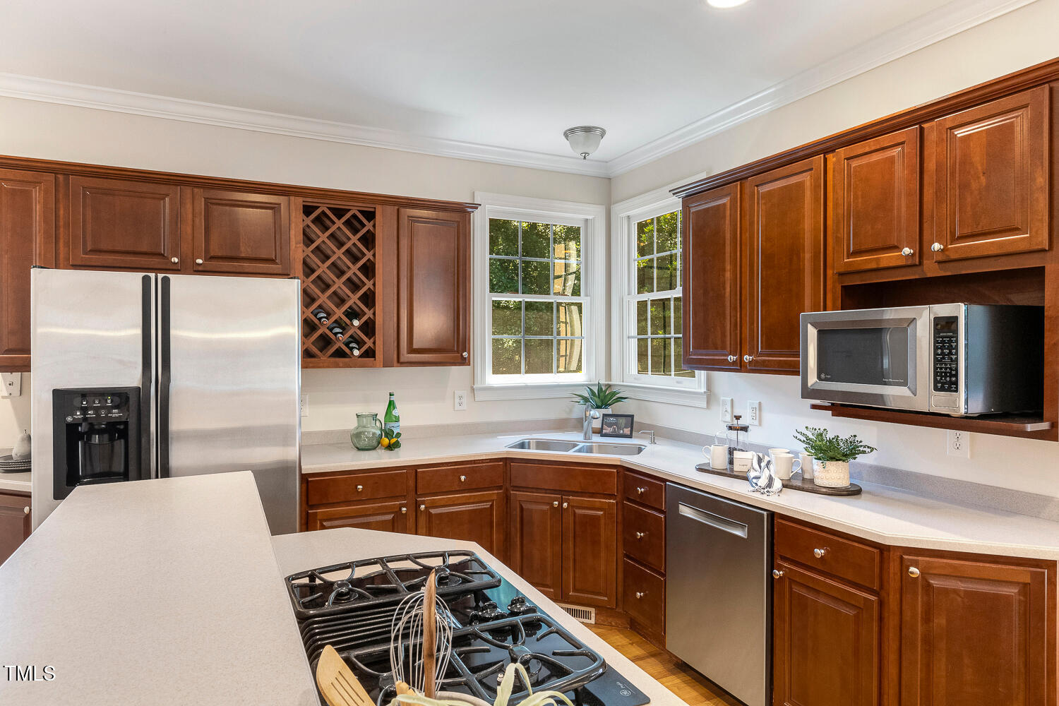 2628 Hunters Meadow Lane Raleigh, NC 27606 - Photo 19 of 76 a kitchen with stainless steel appliances a sink stove and cabinets