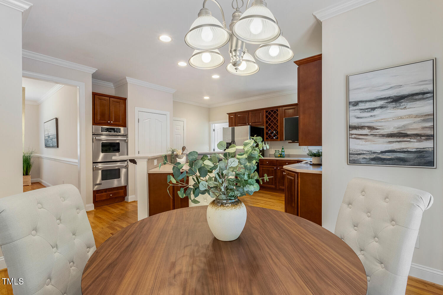 2628 Hunters Meadow Lane Raleigh, NC 27606 - Photo 22 of 76 a kitchen with a table and chairs