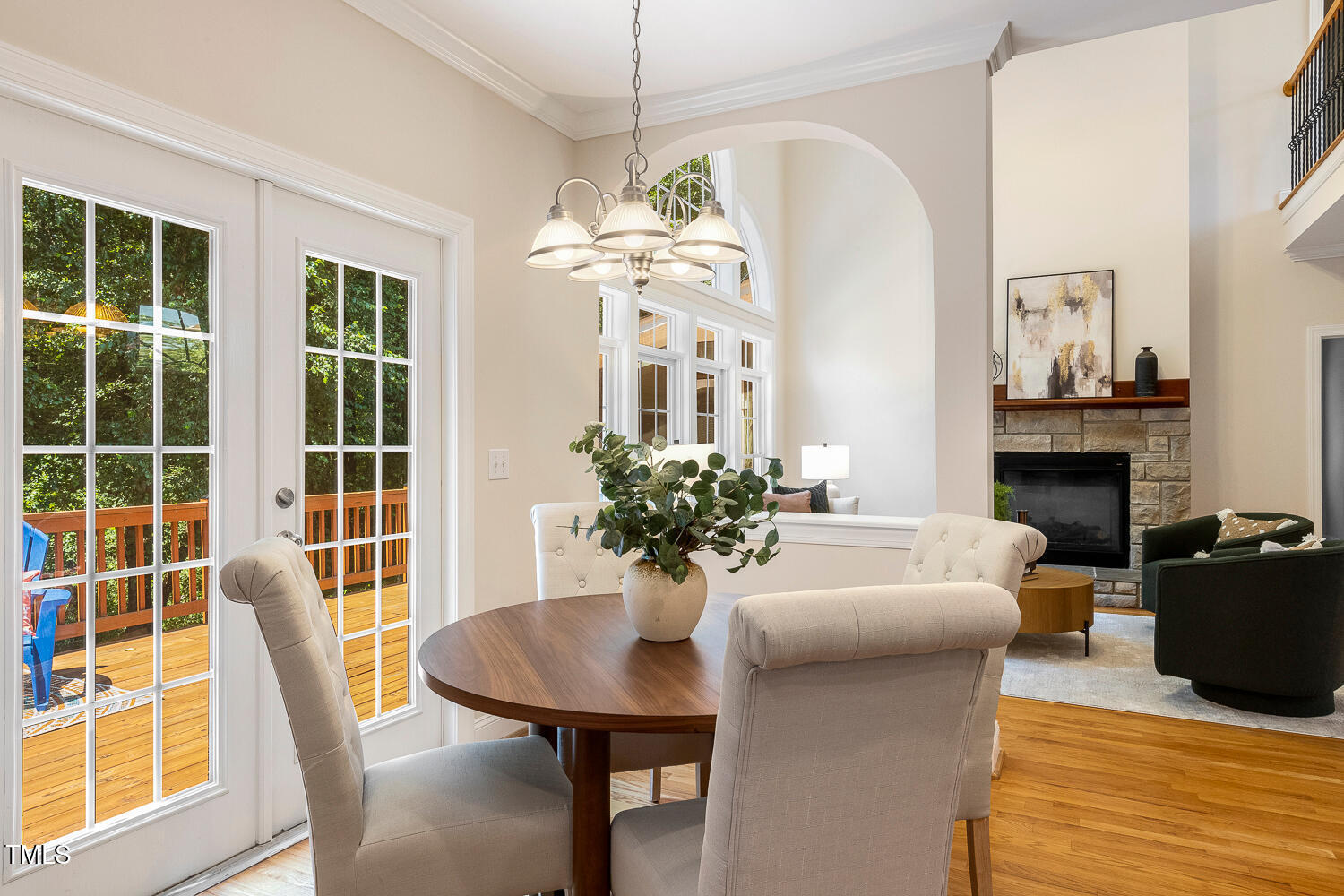 2628 Hunters Meadow Lane Raleigh, NC 27606 - Photo 23 of 76 a view of a dining room with furniture wooden floor and a chandelier
