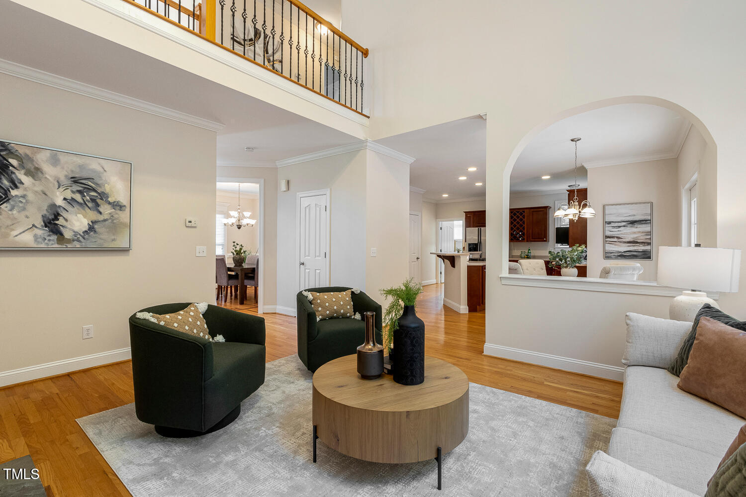 2628 Hunters Meadow Lane Raleigh, NC 27606 - Photo 24 of 76 a living room with furniture and a wooden floor