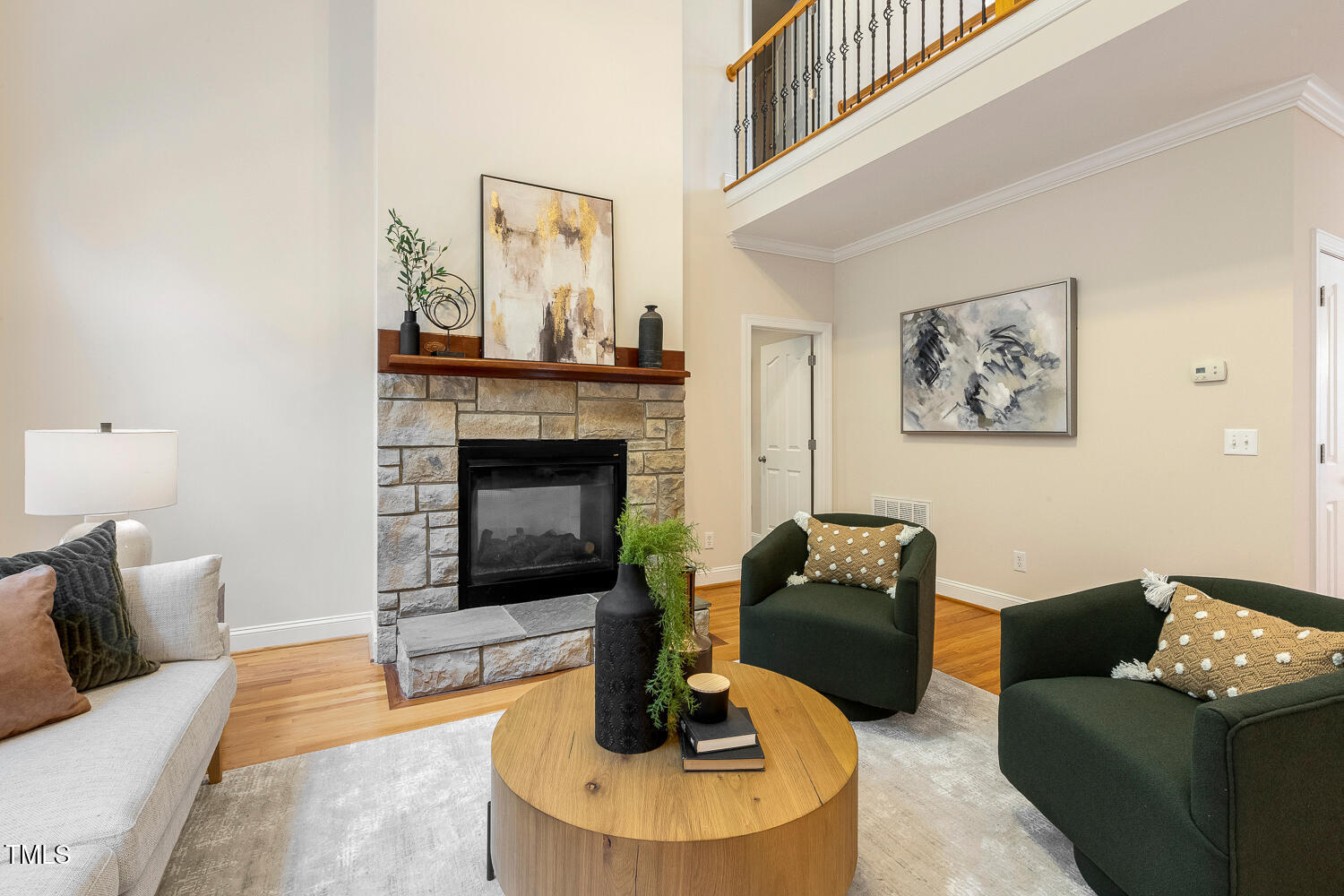 2628 Hunters Meadow Lane Raleigh, NC 27606 - Photo 27 of 76 a living room with furniture and a fireplace