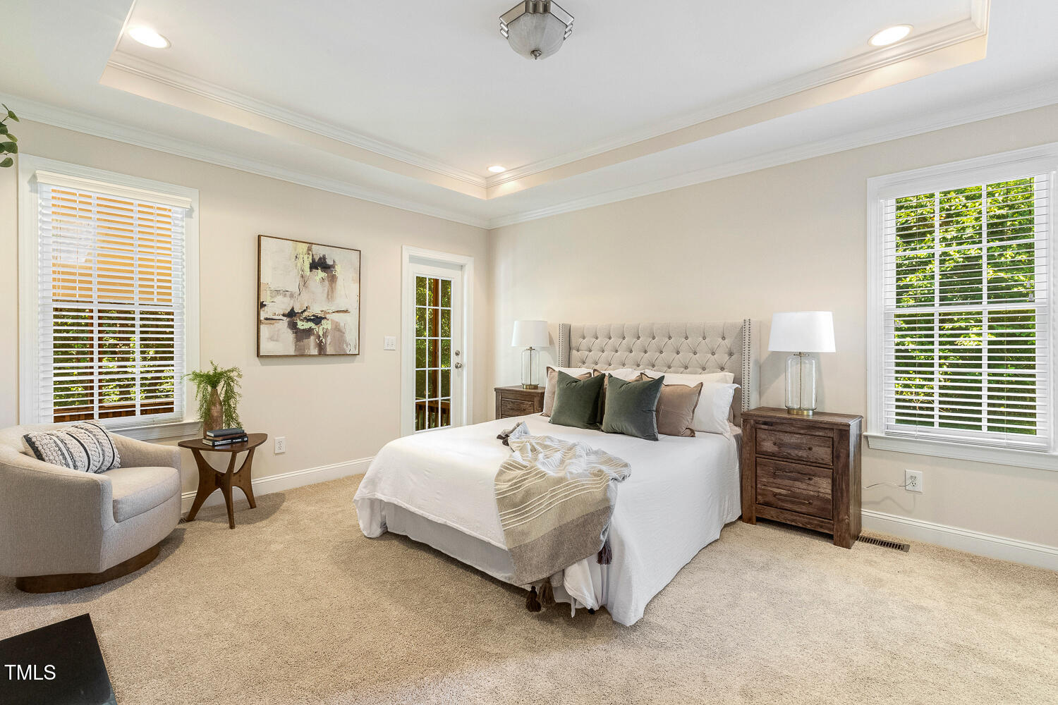2628 Hunters Meadow Lane Raleigh, NC 27606 - Photo 30 of 76 a bedroom with a bed a couch and a window
