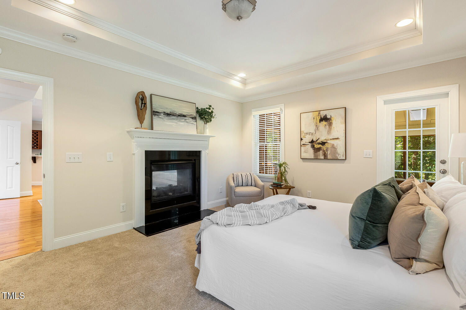 2628 Hunters Meadow Lane Raleigh, NC 27606 - Photo 31 of 76 a bedroom with a bed and a fireplace