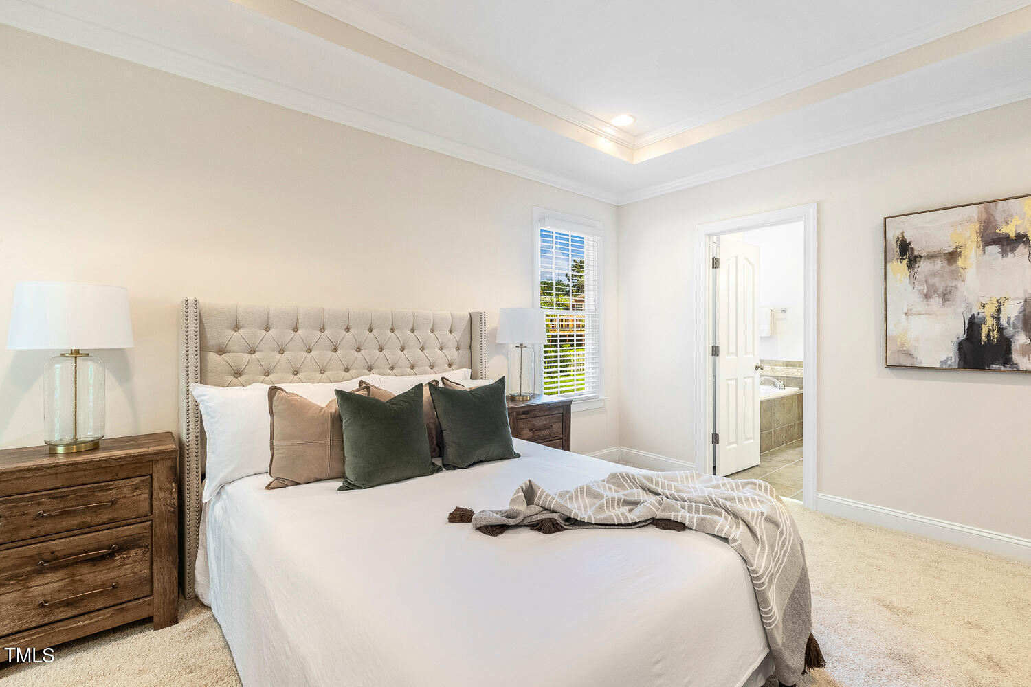 2628 Hunters Meadow Lane Raleigh, NC 27606 - Photo 32 of 76 a bedroom with a bed and a night stand