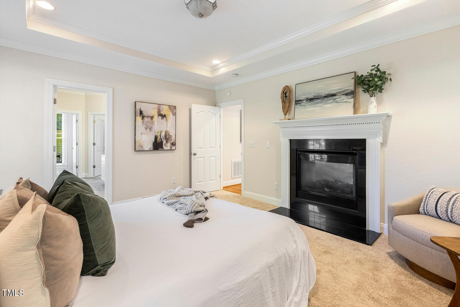 2628 Hunters Meadow Lane Raleigh, NC 27606 - Photo 33 of 76 a bedroom with a bed and a couch