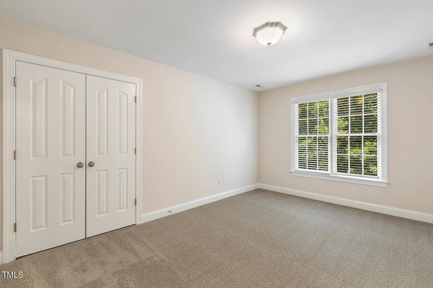 2628 Hunters Meadow Lane Raleigh, NC 27606 - Photo 44 of 76 an empty room with a window