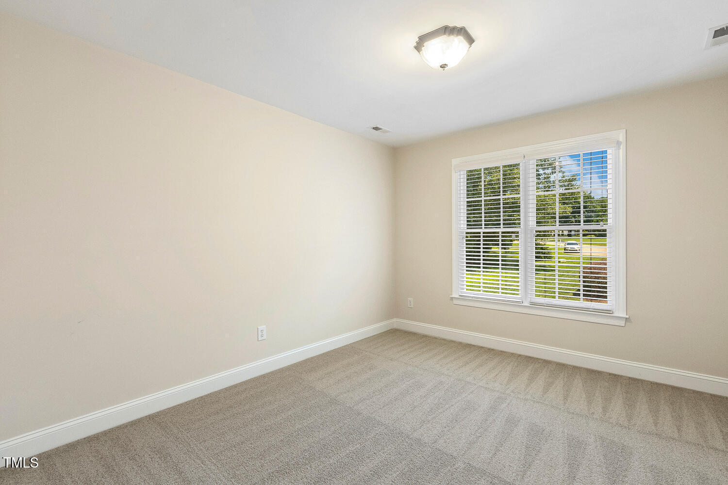 2628 Hunters Meadow Lane Raleigh, NC 27606 - Photo 48 of 76 an empty room with a window