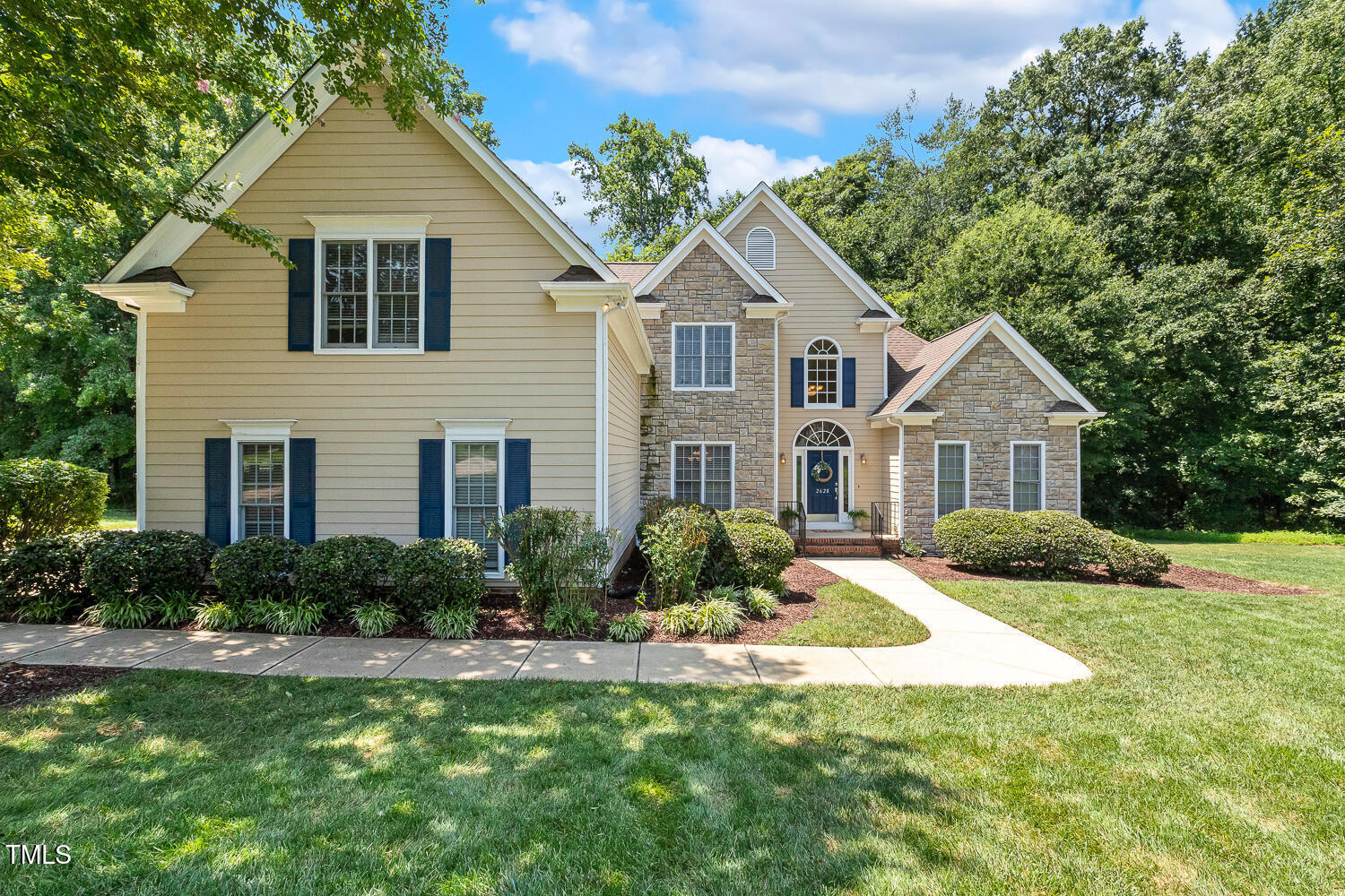 2628 Hunters Meadow Lane Raleigh, NC 27606 - Photo 5 of 76 a front view of house with yard and green space