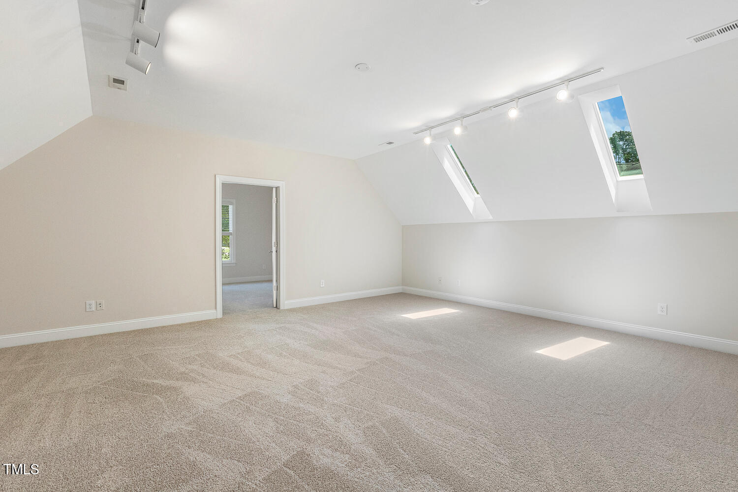 2628 Hunters Meadow Lane Raleigh, NC 27606 - Photo 52 of 76 a view of an empty room with a window