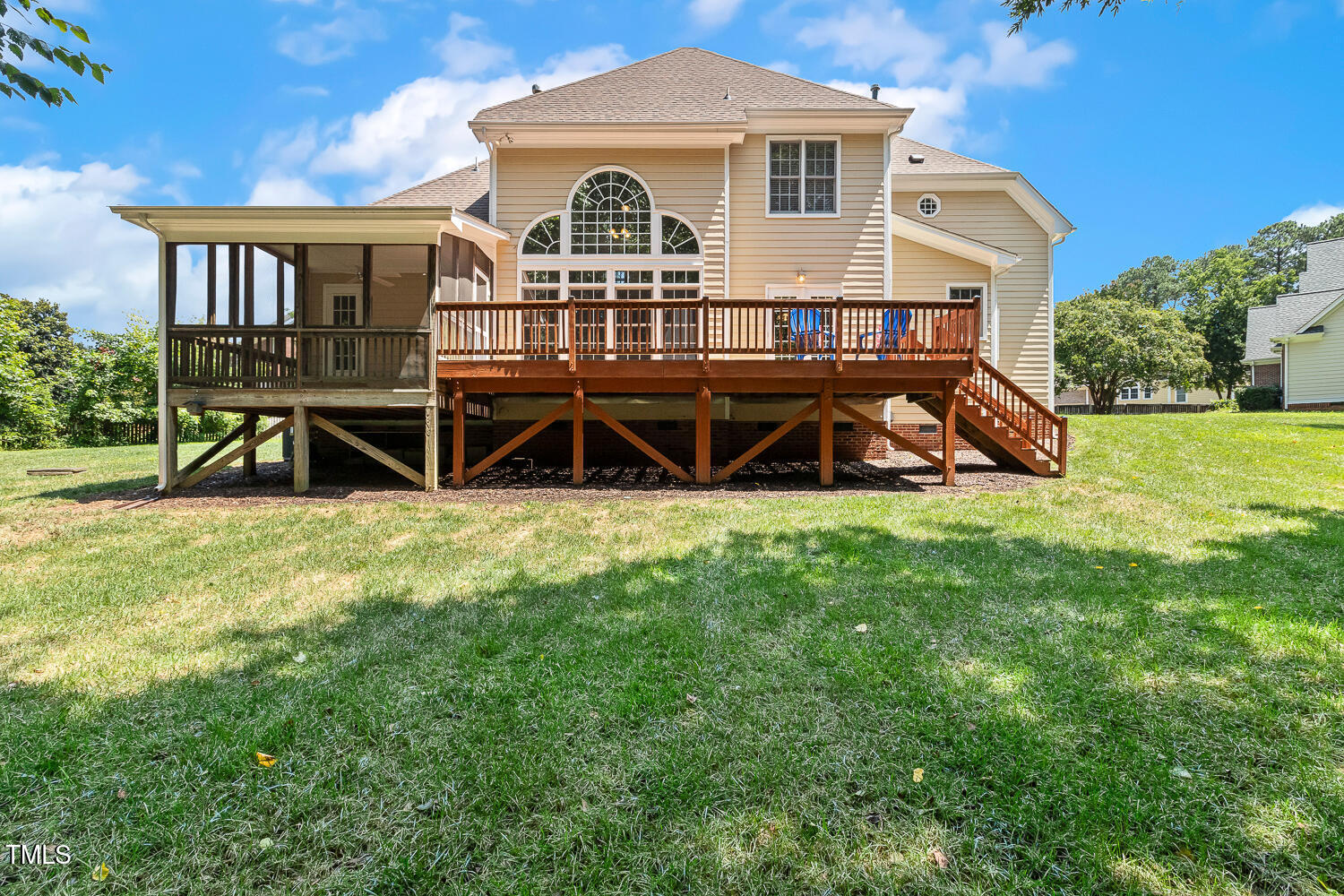 2628 Hunters Meadow Lane Raleigh, NC 27606 - Photo 67 of 76 a view of a house with a yard and deck