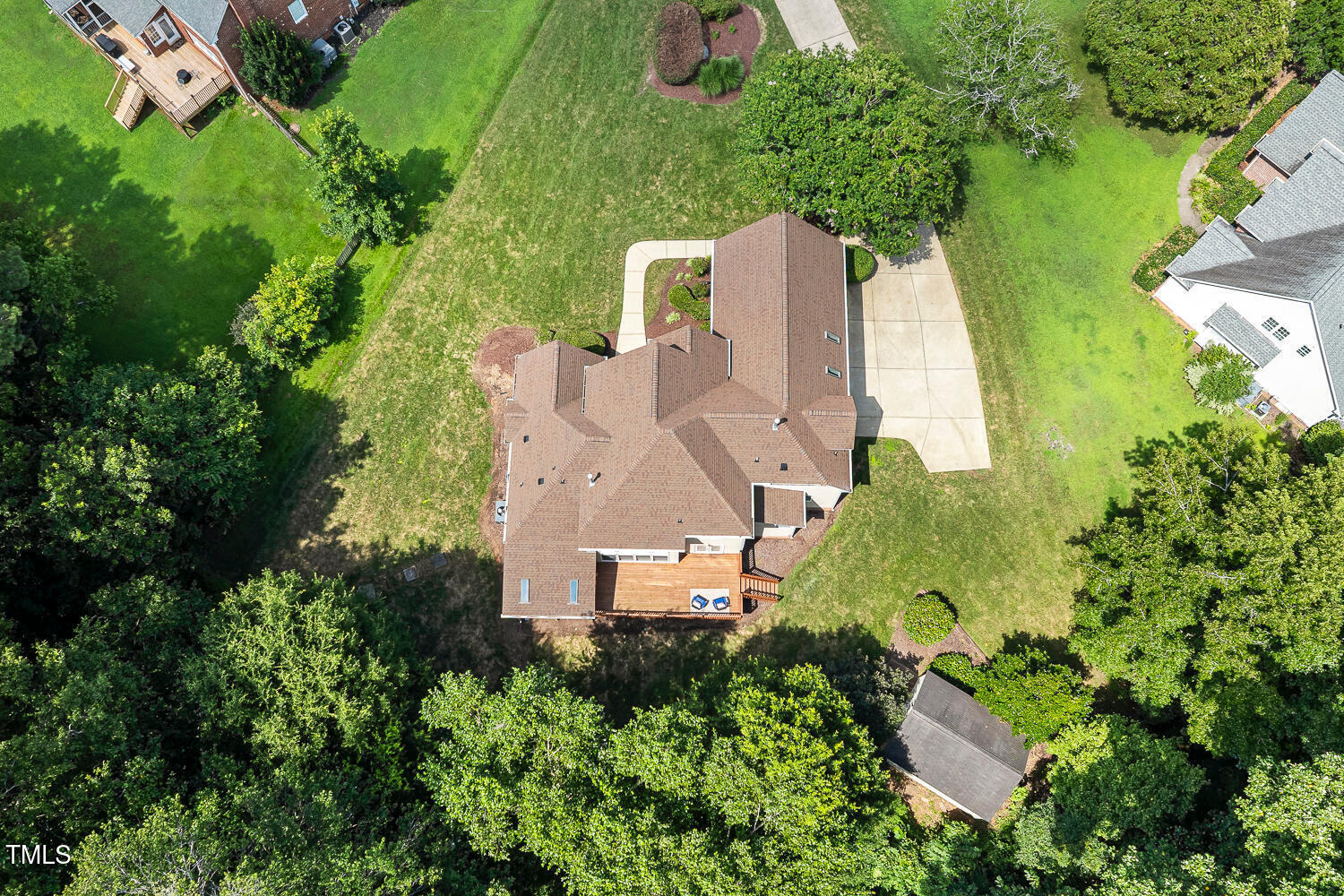 2628 Hunters Meadow Lane Raleigh, NC 27606 - Photo 74 of 76 an aerial view of a house with outdoor space and trees all around