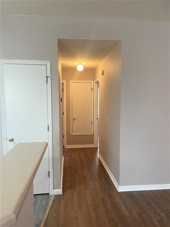 3201 C El Salido Parkway, Unit 221 Cedar Park, TX 78613 - Photo 12 of 18 a view of a room with an empty space and wooden floor