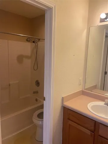 a bathroom with a sink a toilet and a bathtub