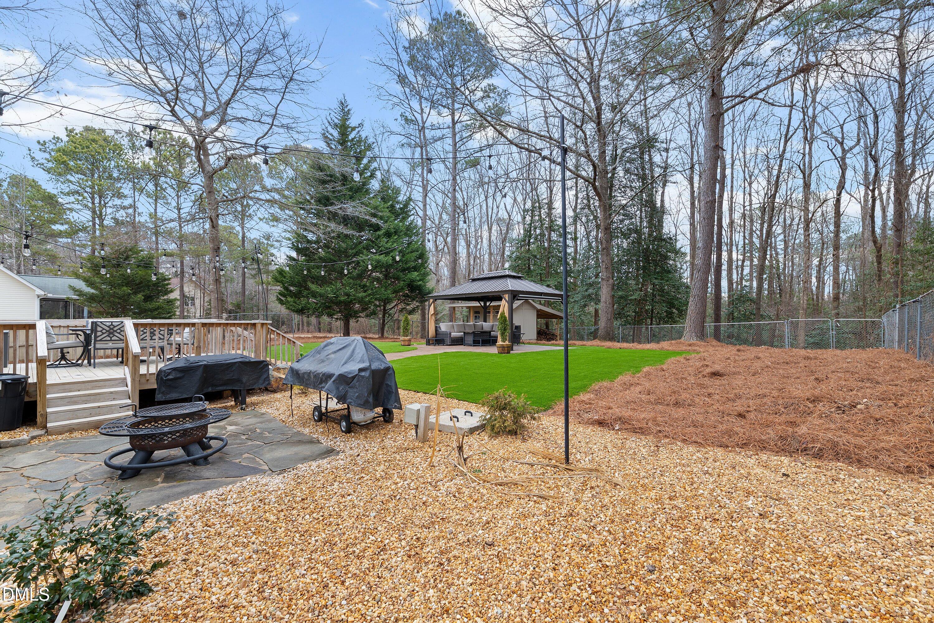 234 Linville Lane Willow Spring, NC 27592 - Photo 27 of 34 a park view with a bench and trees