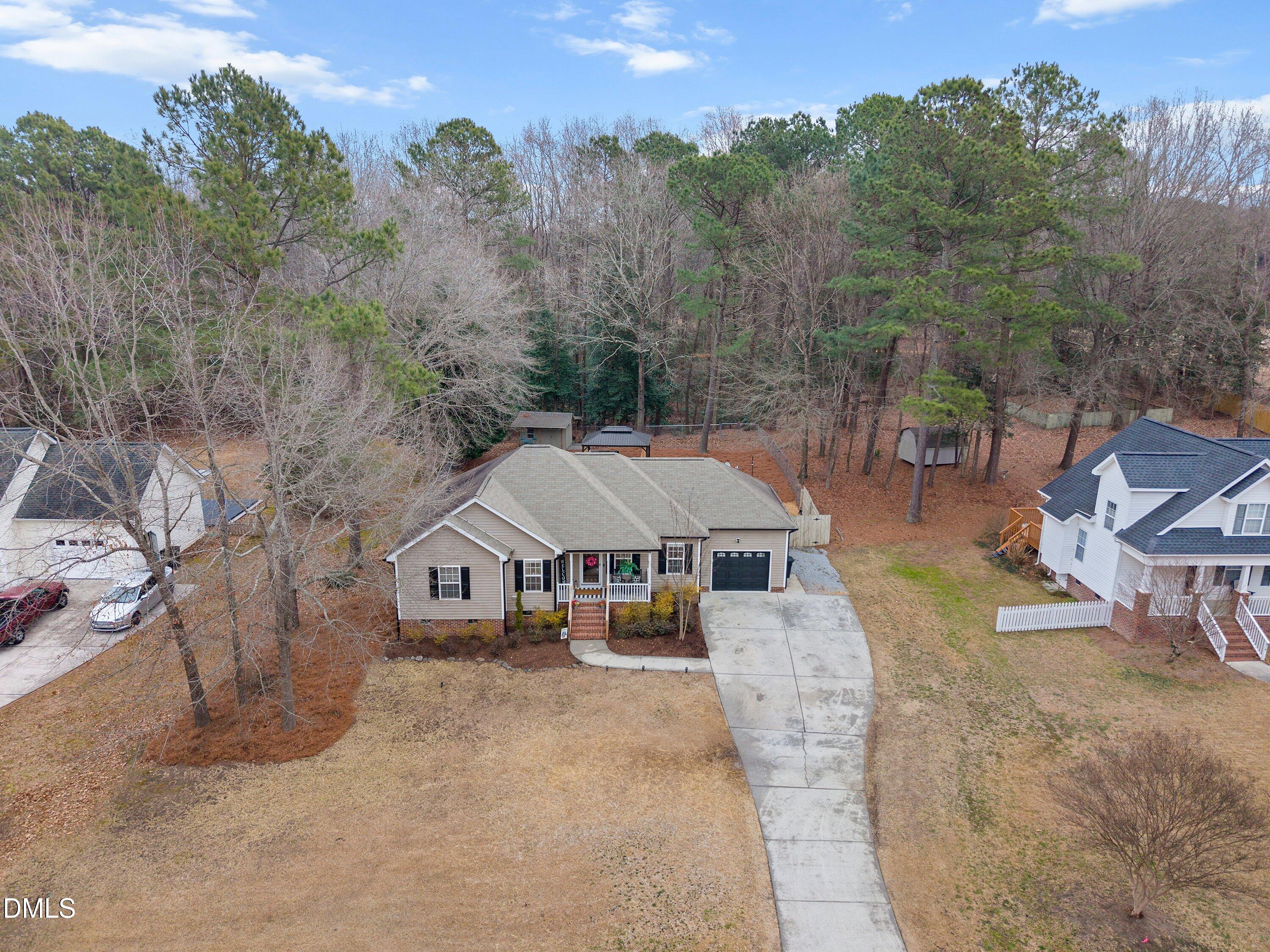 234 Linville Lane Willow Spring, NC 27592 - Photo 31 of 34 an aerial view of a house with swimming pool and sitting area
