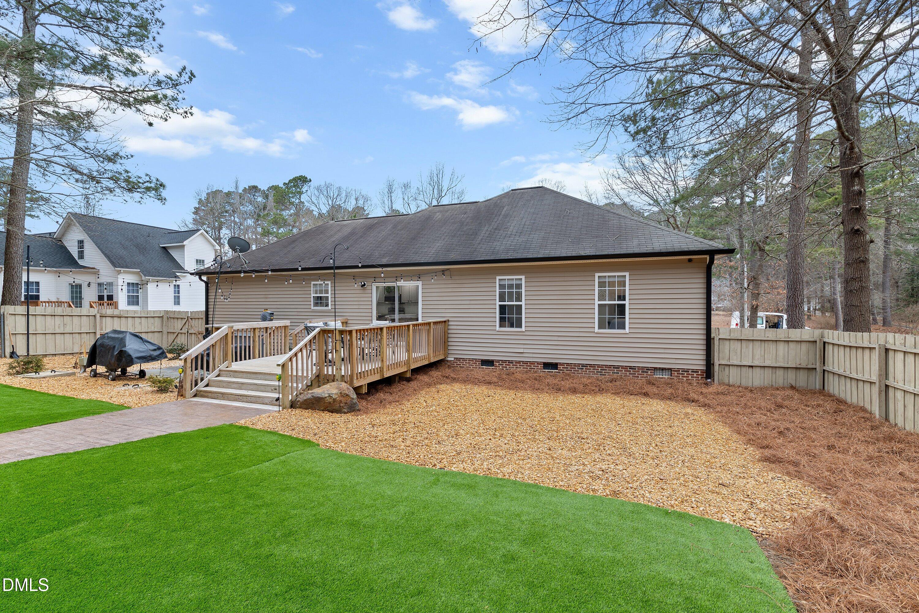 234 Linville Lane Willow Spring, NC 27592 - Photo 5 of 34 a view of a house with backyard and sitting area