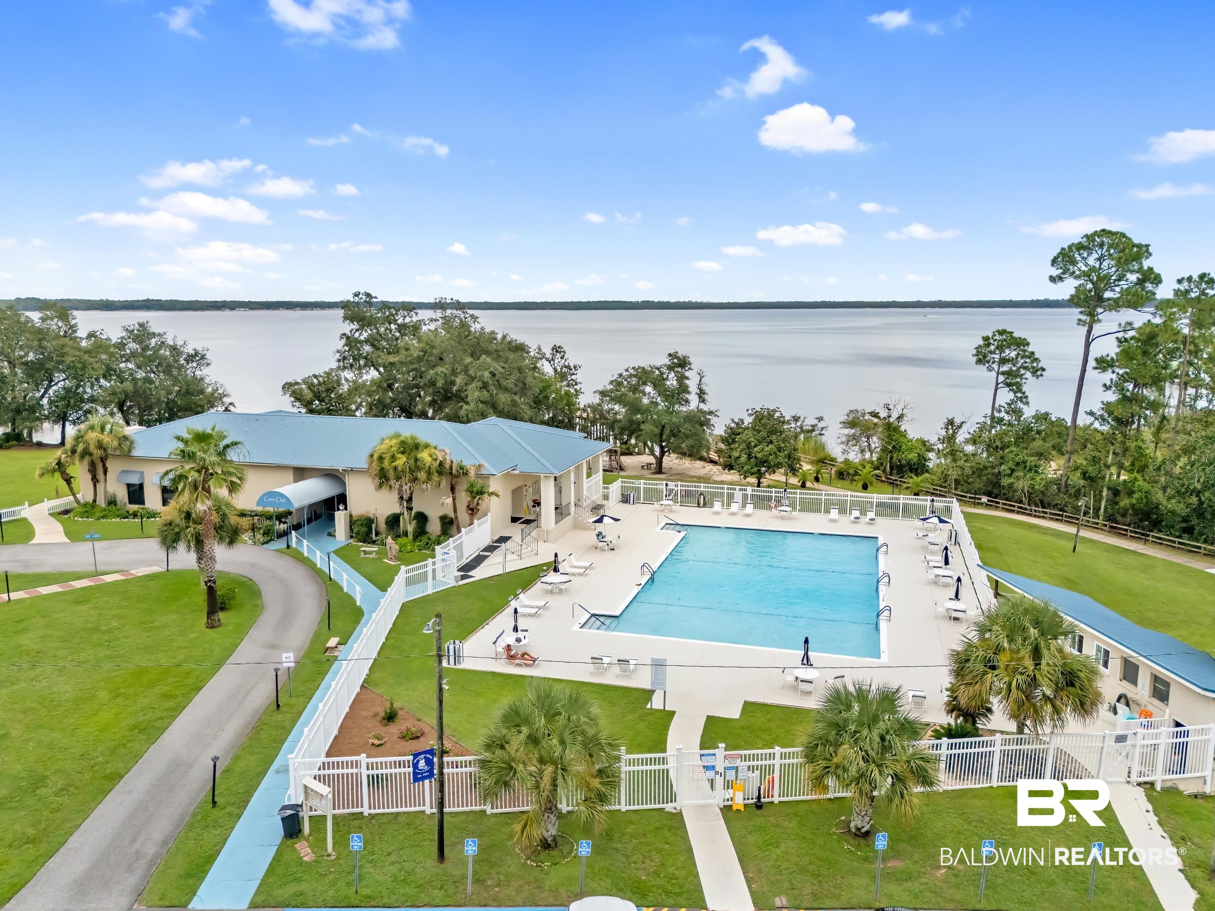 182 Defuniak Loop Lillian, AL 36549 - Photo 14 of 21 Drone / aerial view of a nearby body of water and a pool