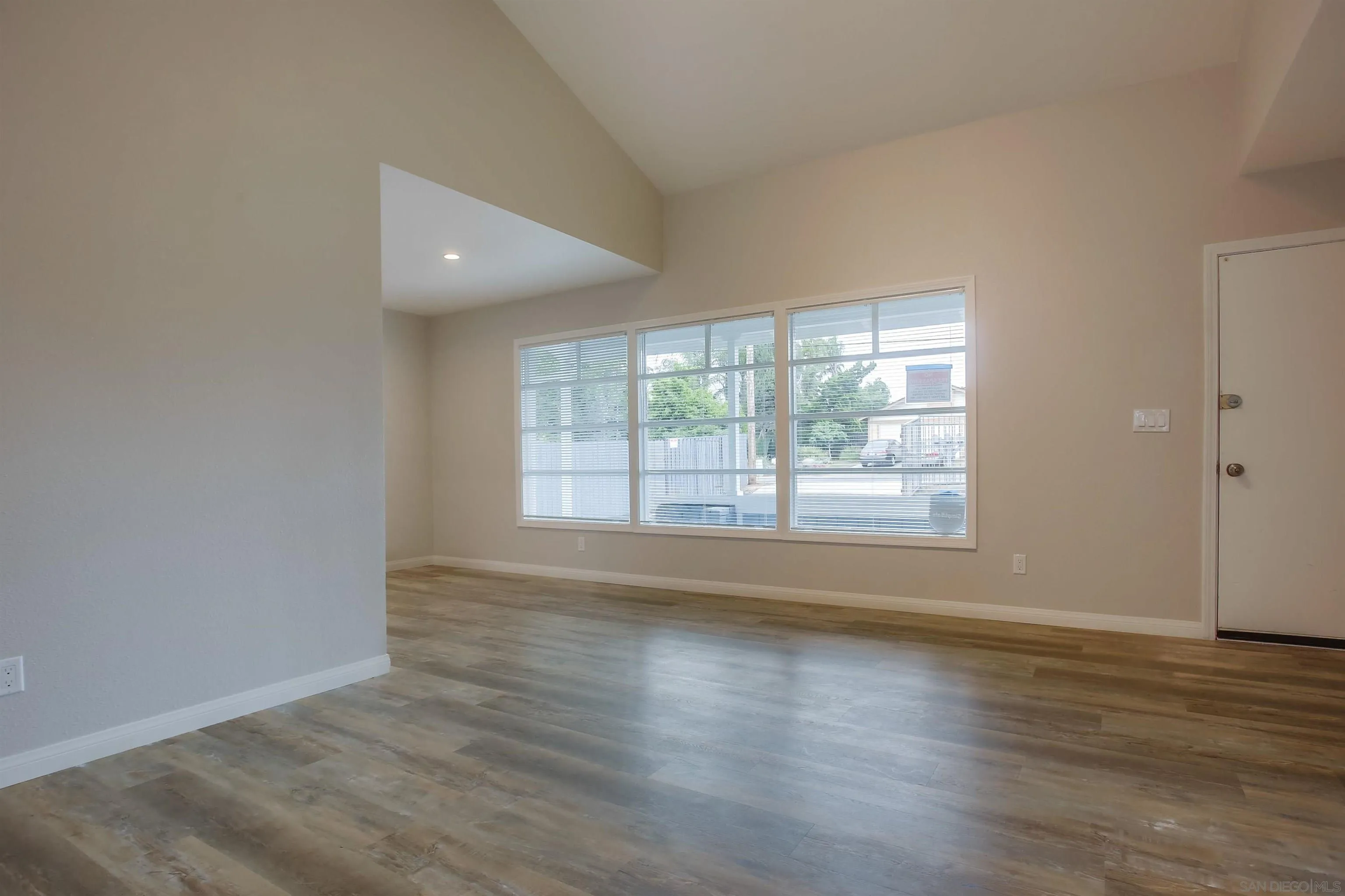 1055 Old Stage Road Fallbrook, CA 92028 - Photo 5 of 16 a view of an empty room with wooden floor and a window