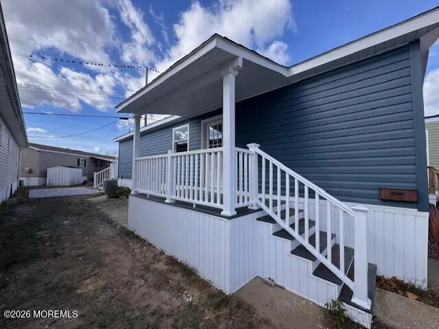 a view of balcony with wooden floor and stairs