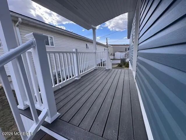 a view of balcony with wooden floor