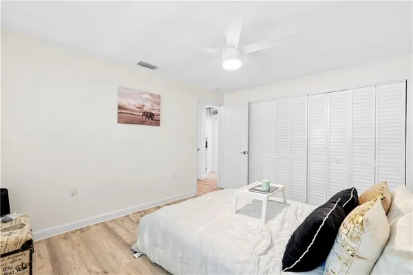 a bedroom with a bed and a couch