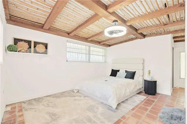 a bedroom with a bed and a walk in closet