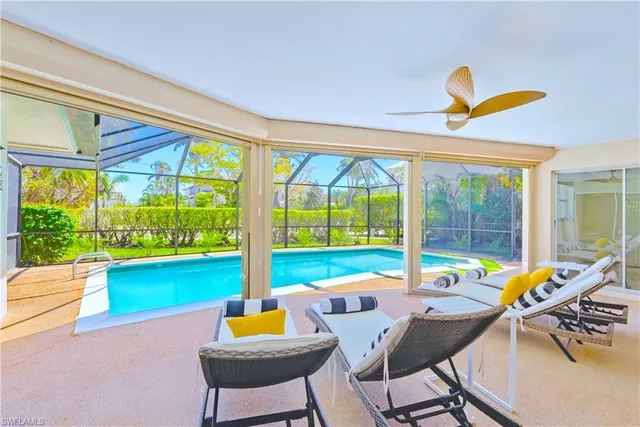 a room with furniture and a large window