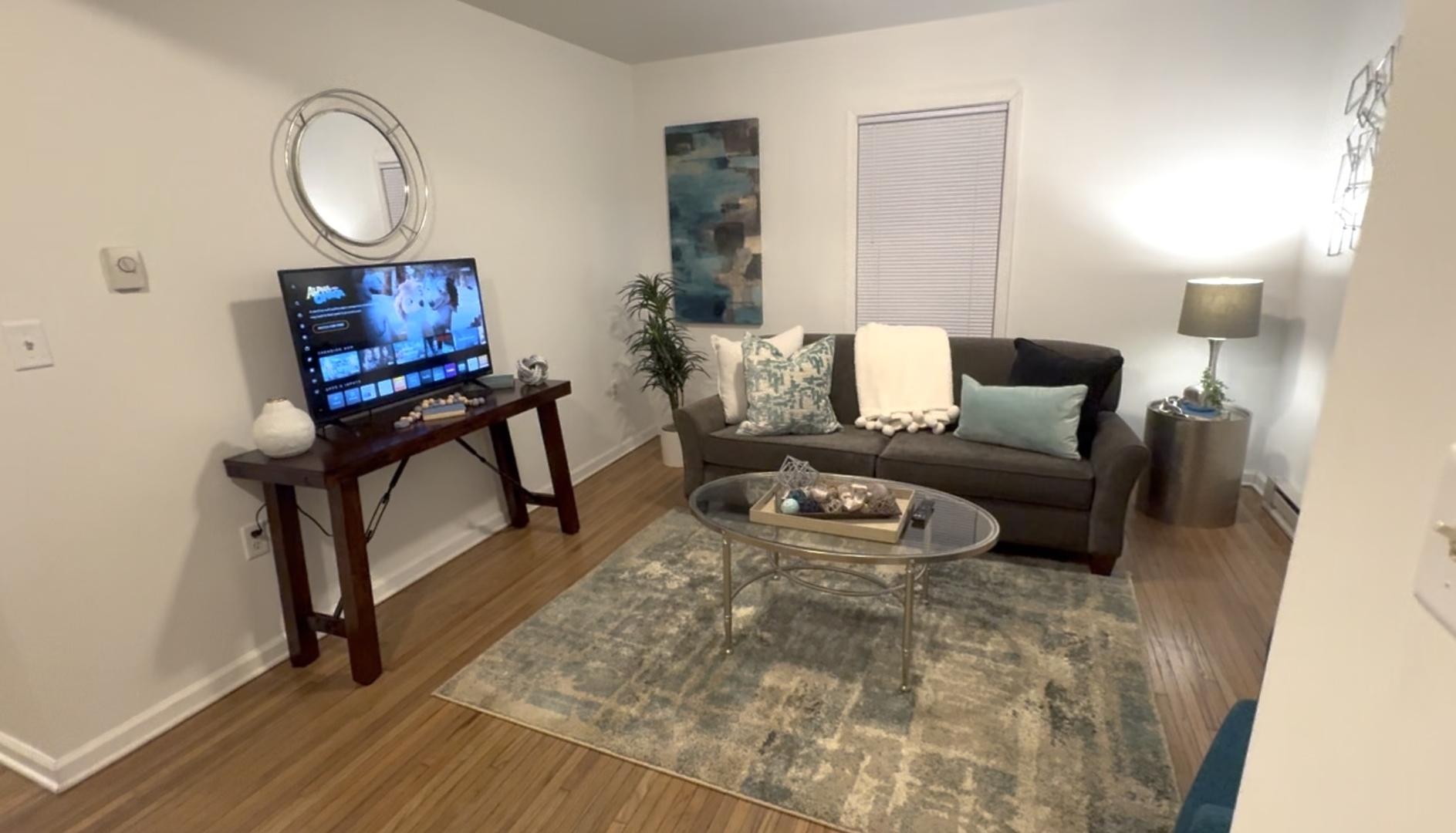 116 North 9th Street DeKalb, IL 60115 - Photo 15 of 20 a living room with furniture and a wooden floor