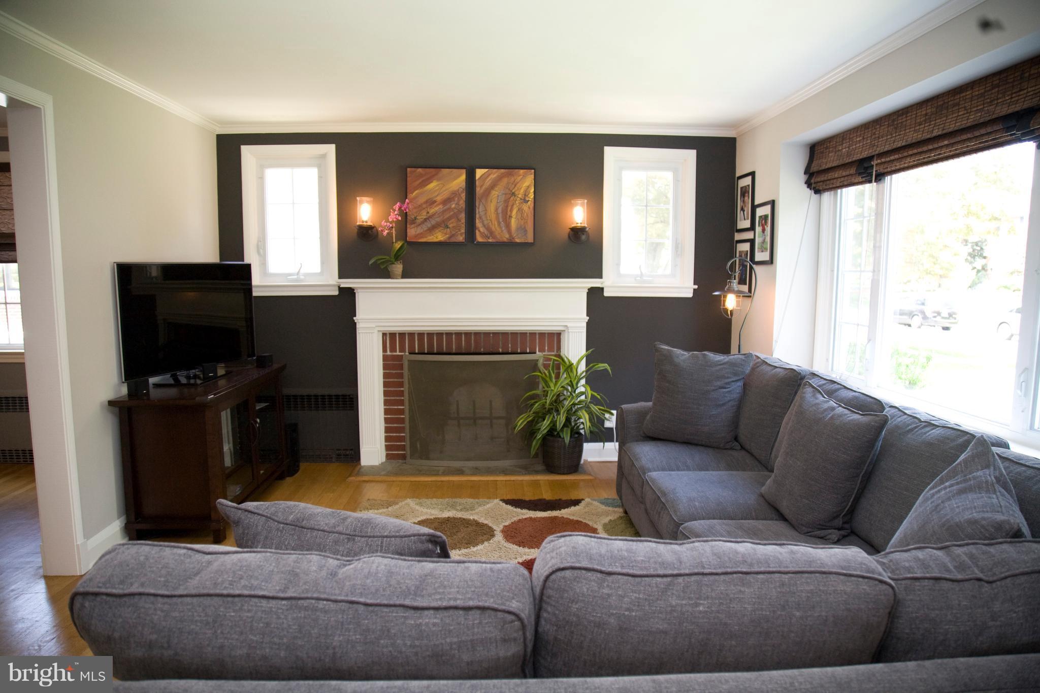 623 Overbrook Road Baltimore, MD 21212 - Photo 11 of 30 a living room with furniture and a fireplace