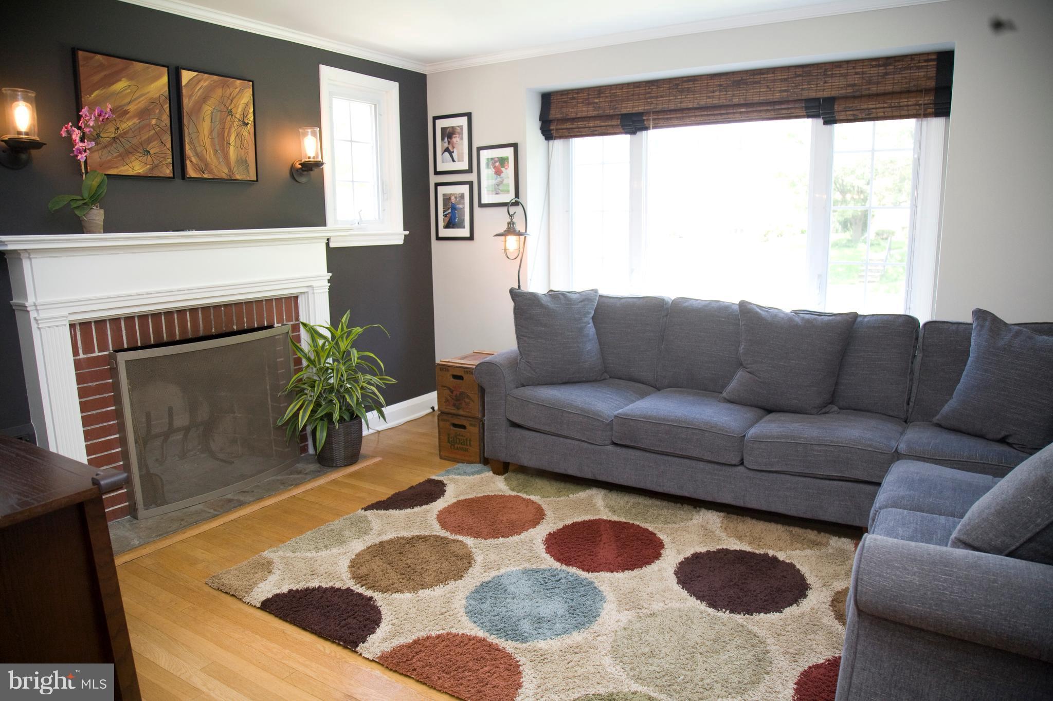 623 Overbrook Road Baltimore, MD 21212 - Photo 12 of 30 a living room with furniture and a fireplace