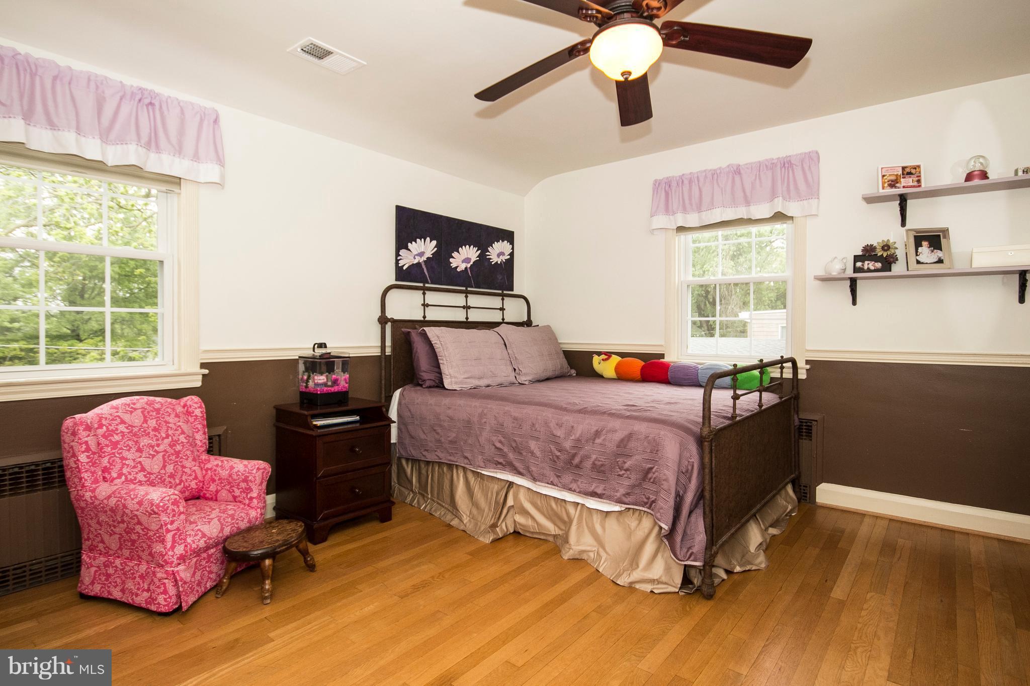 623 Overbrook Road Baltimore, MD 21212 - Photo 22 of 30 a bedroom with a bed dresser and a window