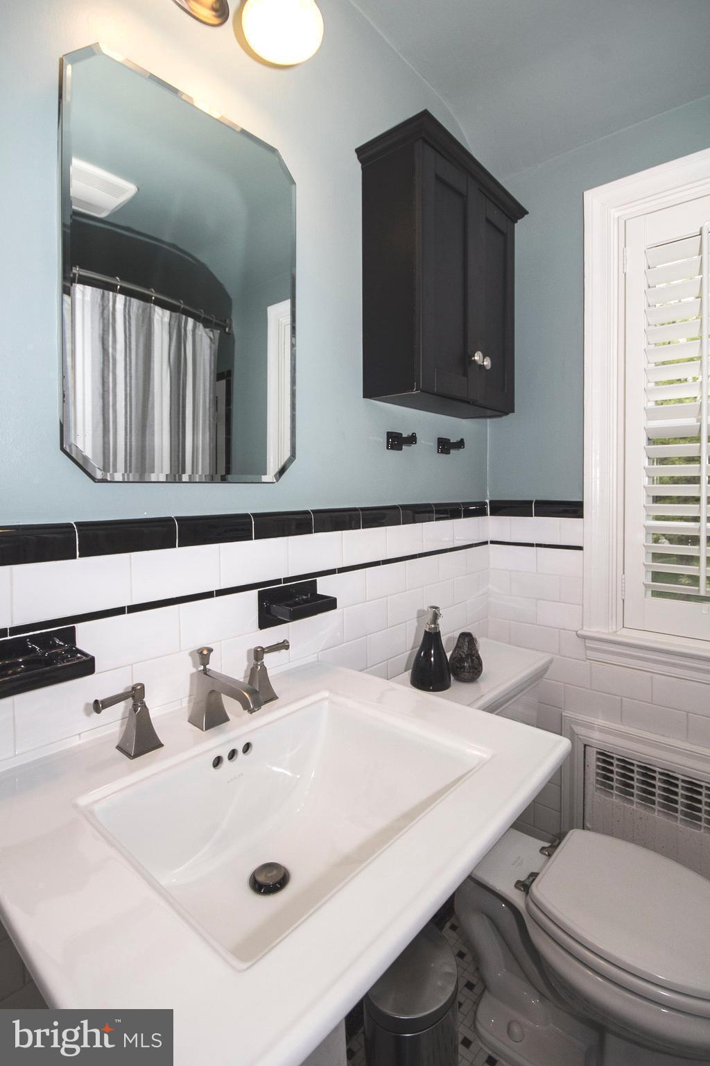 623 Overbrook Road Baltimore, MD 21212 - Photo 25 of 30 a bathroom with a sink and a toilet