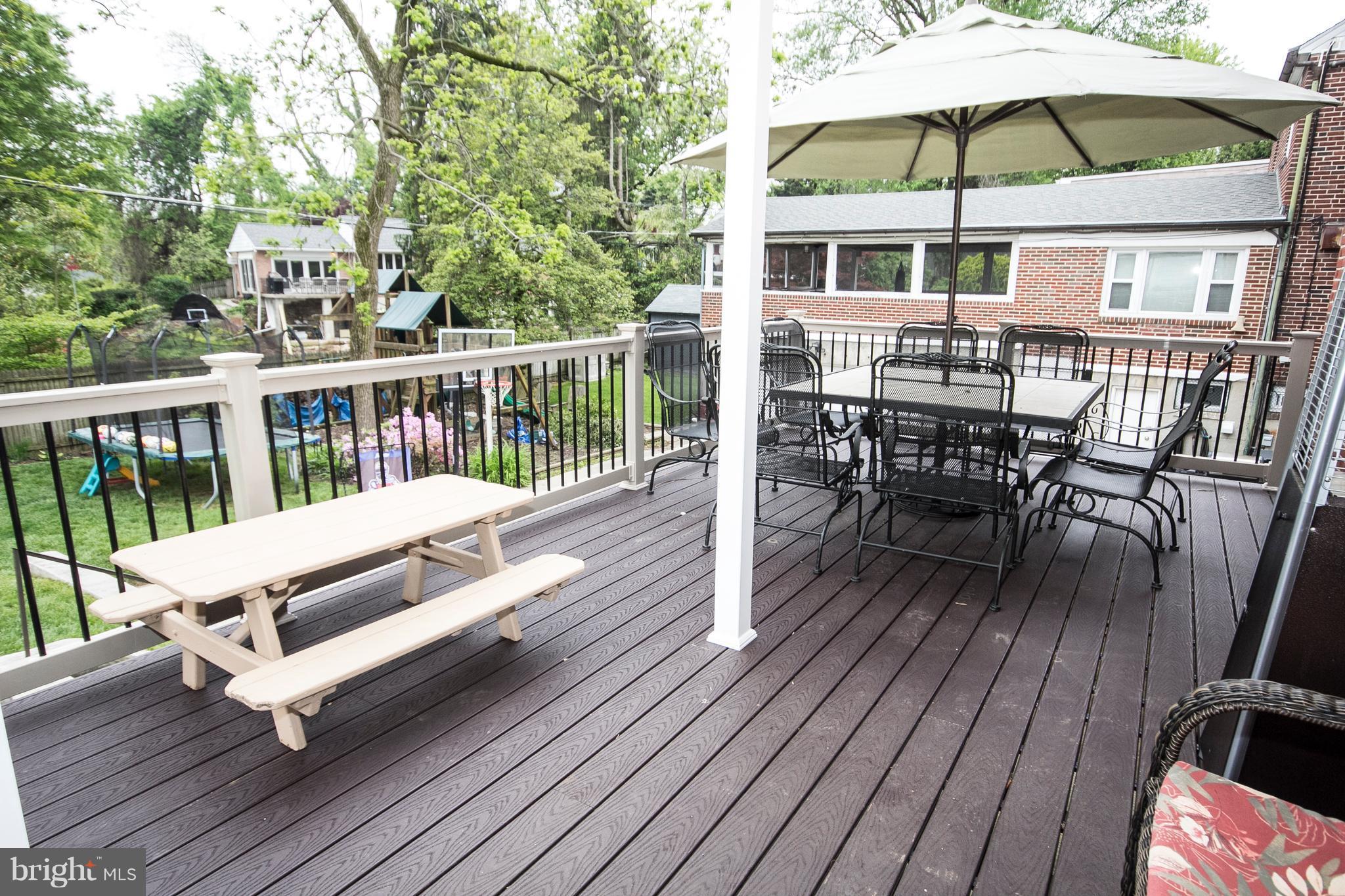 623 Overbrook Road Baltimore, MD 21212 - Photo 6 of 30 a view of a chairs and table on the wooden deck