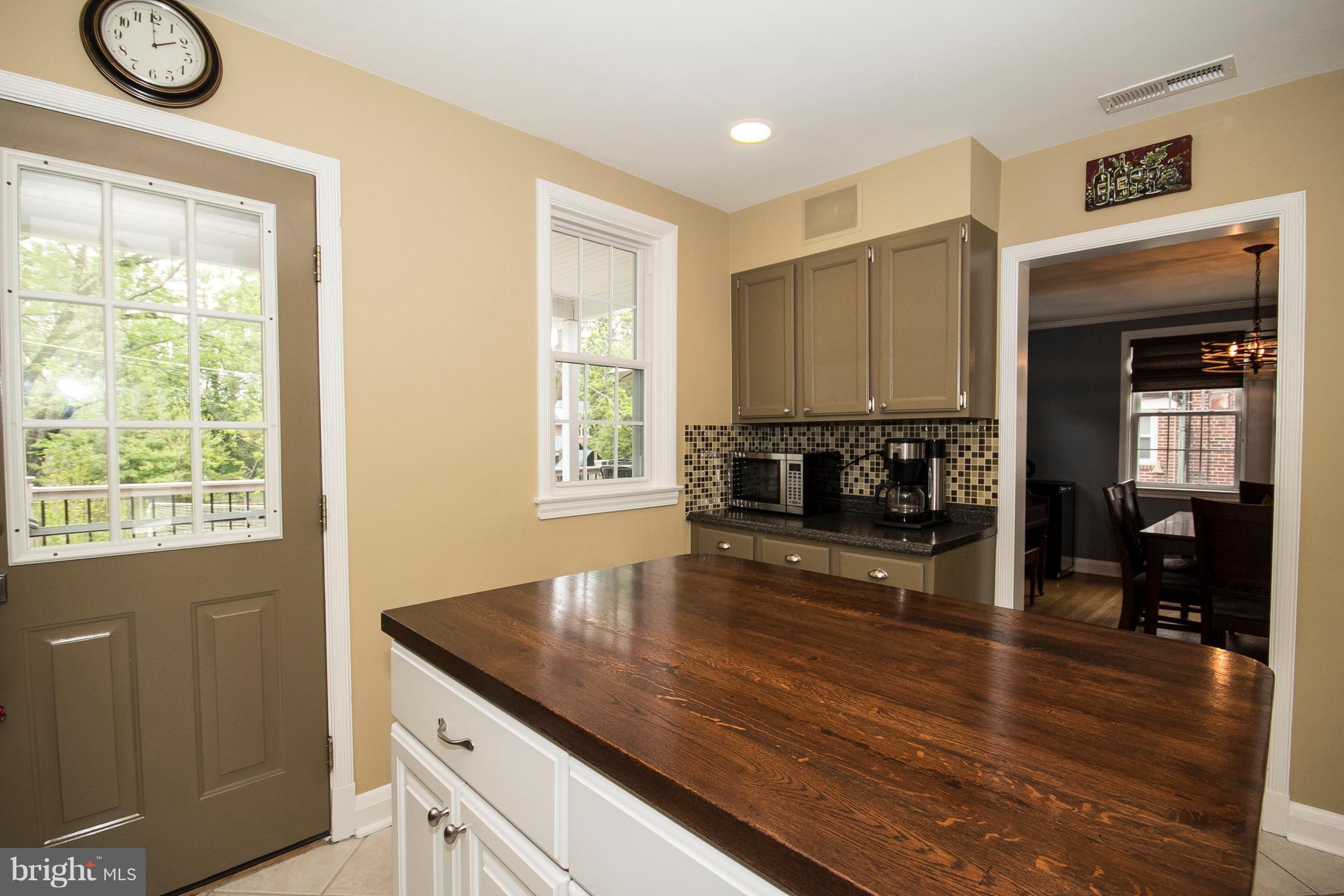 623 Overbrook Road Baltimore, MD 21212 - Photo 10 of 30 a kitchen view with wooden floor and a window